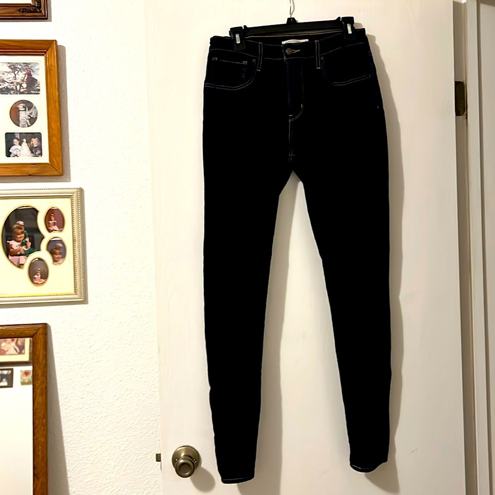Levi 721 hi-rise, skinny jeans, very dark in color.